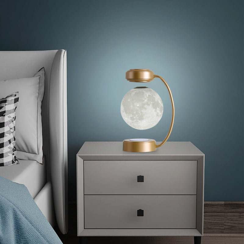 Moon Night Light 3D LED Magnetic Levitating Floating Lamp illuminating a dark space with a glowing moon design. Moon Night Light 3D LED Magnetic Levitating Floating Lamp illuminating a dark space with a glowing moon design.