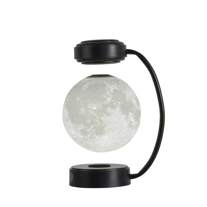 Moon Night Light 3D LED Magnetic Levitating Floating Lamp illuminating a dark space with a glowing moon design. Moon Night Light 3D LED Magnetic Levitating Floating Lamp illuminating a dark space with a glowing moon design.