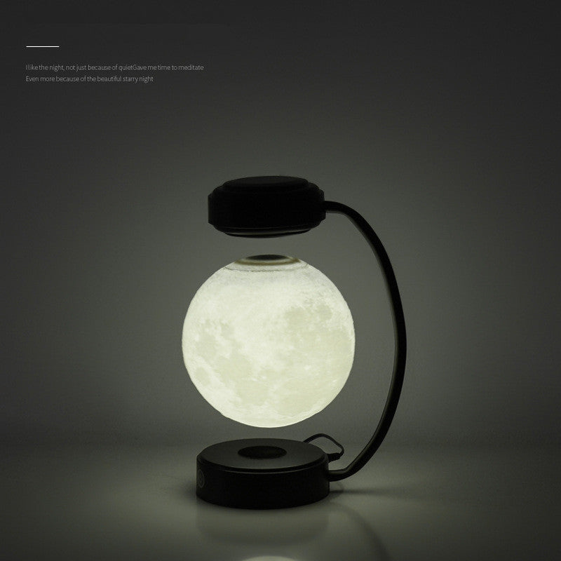 Moon Night Light 3D LED Magnetic Levitating Floating Lamp illuminating a dark space with a glowing moon design. Moon Night Light 3D LED Magnetic Levitating Floating Lamp illuminating a dark space with a glowing moon design.
