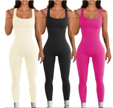 9d7286c4f2b7e7e55dfeaf347afd6404Women's Suspender Tank Top Tights in black worn by a model at the beach, showcasing a stylish and comfortable fit.